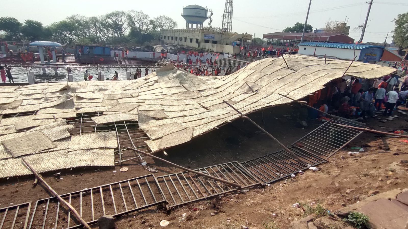 Devotees stuck under the collapsed pandal in Jagtial