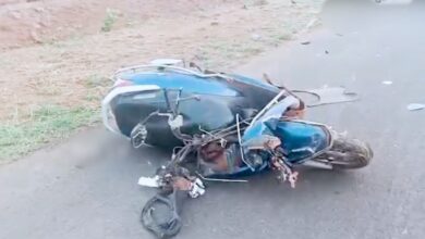 A two-wheeler mangled in the accident in Vikarabad