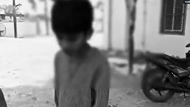 Student being disciplined by a principal in Telangana despite corporal punishment ban.