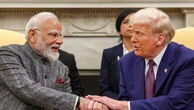 US President Trump and Indian Prime Minister Modi shaking hands during a diplomatic meeting.