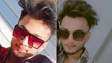 Young man with sunglasses and styled hair, outdoors.