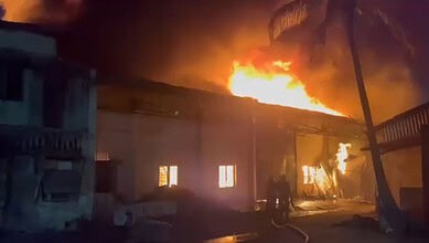 Fire at Nacharam building with flames and smoke engulfing the structure.