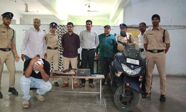 Police officers and officials with seized motorcycle and items at a crime scene.