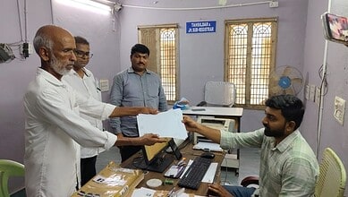 A farmer receives survey map in Khammam