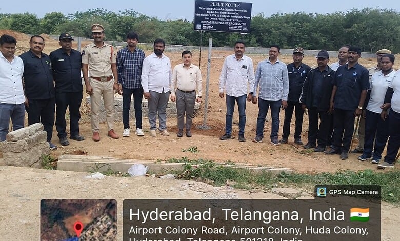 HYDRAA officials erect a board on the land in Shamshabad