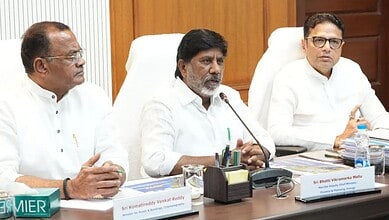 Officials seated at a conference table during a formal meeting.