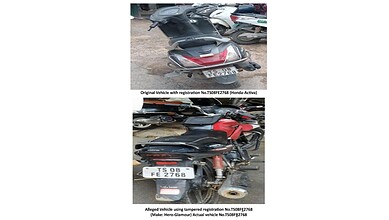 Image shows two vehicles with tampered registration plates, highlighting illegal use of fake number plate.