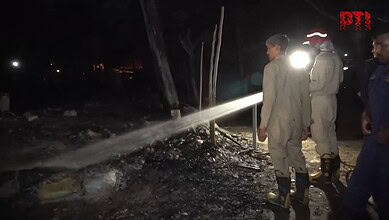 Firemen at work at fire site in Delhi