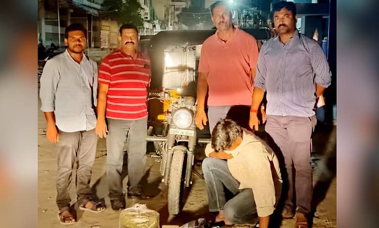 Motorcycle repair team fixing a bike at night, showcasing skilled mechanics and urban environment in Indi.