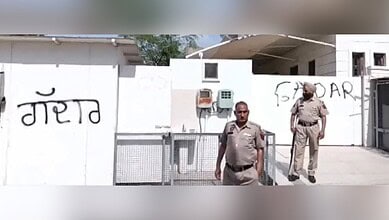 Punjab AAP workers write 'Gaddar' outside Harbhajan Singh's house in a political protest.