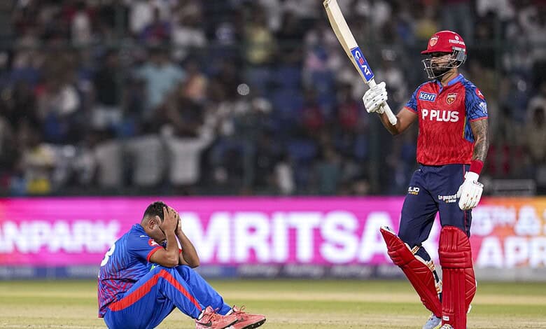 Punjab Kings player celebrating a victory during a cricket match against Delhi Capitals.
