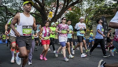 Runners participating in Bengaluru’s TCS World 10K race, showcasing diverse athletes in action during the.