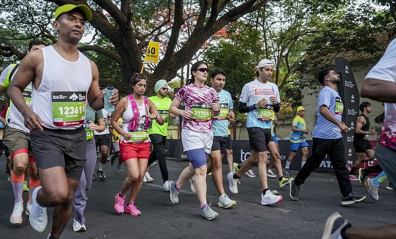 Runners participating in Bengaluru’s TCS World 10K race, showcasing diverse athletes in action during the.