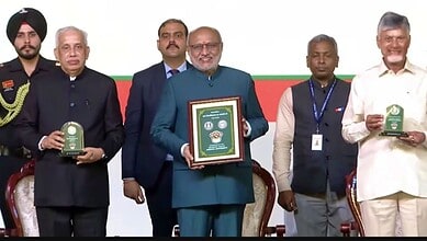Vice President CP Radhakrishnan reveals a Rs 100 coin at Andhra University along with CM Chandrababu Naidu