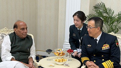 Rajnath Singh, Indian Defence Minister, in discussion with Chinese military official during bilateral tal.