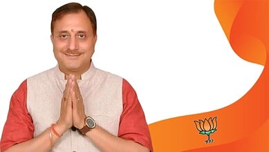 Pravesh Wahi, BJP leader, smiling with folded hands, after being elected MCD mayor, in a celebratory mome.