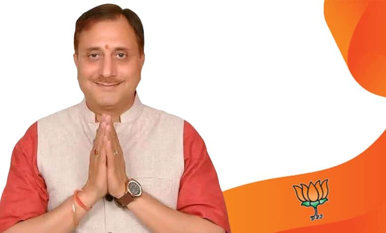 Pravesh Wahi, BJP leader, smiling with folded hands, after being elected MCD mayor, in a celebratory mome.