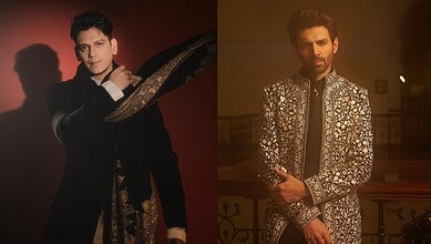 Vijay Varma poses in a fashionable black and gold outfit, highlighting his style for a celebrity photosho.