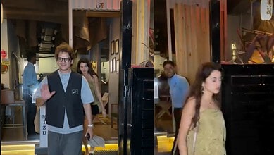 Young woman walking into an event venue with a man waving and smiling in the background.