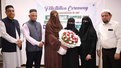 Telangana inter topper from MS Junior College receiving a bouquet at the felicitation ceremony.