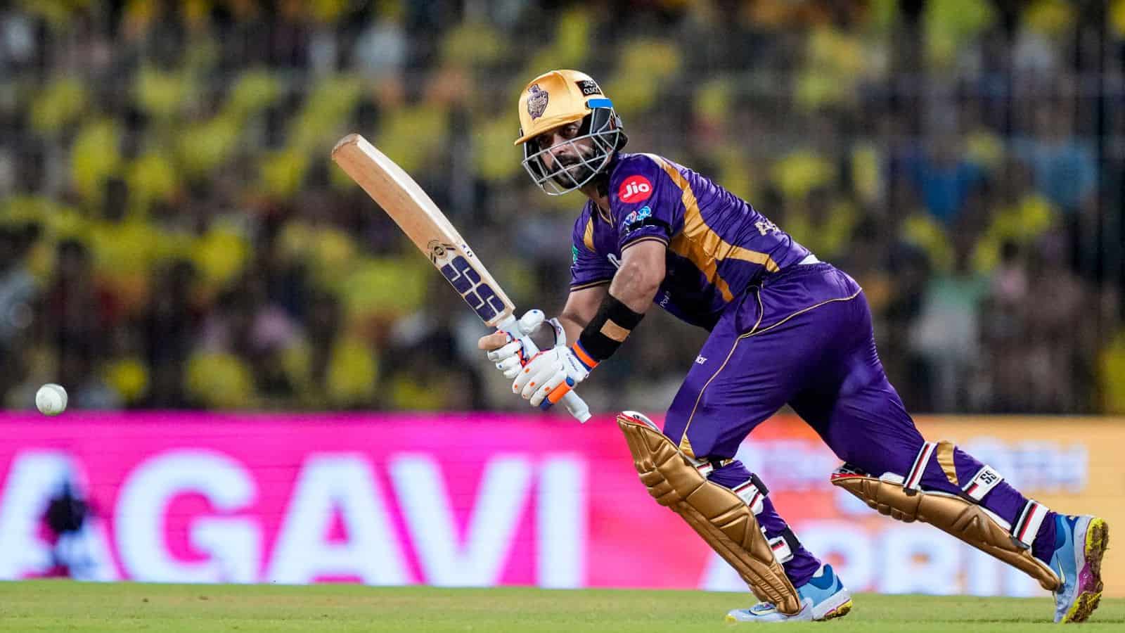 Kolkata Knight Riders cricketer in purple uniform batting during a match.