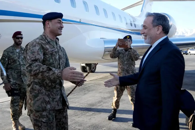 Iran’s Foreign Minister Abbas Araghchi greets Pakistan army chief Asim Munir on arrival in Tehran.