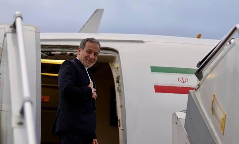 Businessman boarding an aircraft at the airport, ready for travel, with the Iranian flag visible on the p.