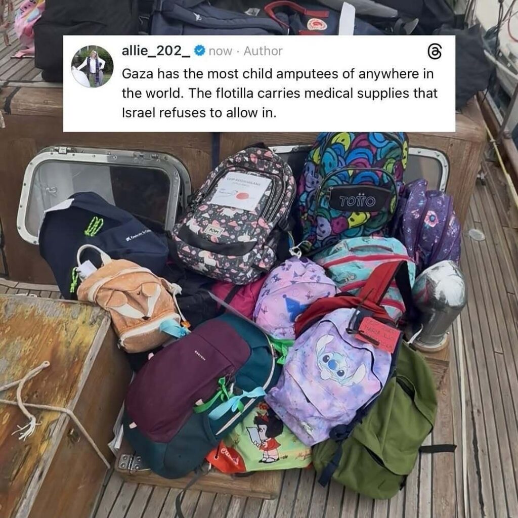 Backpacks filled with school supplies placed on a boat as part of Gaza-bound aid cargo.