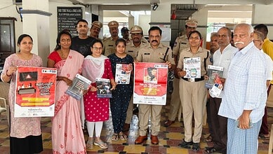 Police and community members participate in cyber safety awareness event.