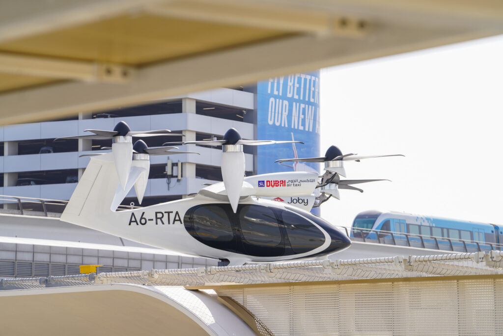 Joby electric air taxi aircraft stationed on rooftop Joby air taxi on landing pad at Dubai station pad in Dubai.