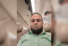 Faiyaz Alam seated inside an aircraft cabin.