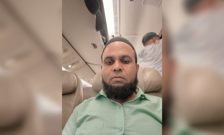 Faiyaz Alam seated inside an aircraft cabin.