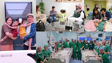 Family with children and a patient in a hospital waiting area, engaging with staff and medical profession.