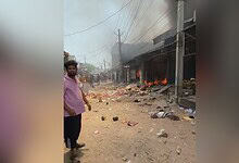 Fire burning at scrap warehouse in Hyderabad's Balapur area, smoke rising.
