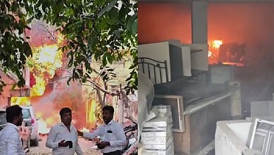 Fire erupts at Mahindra service centre in Hyderabad, with thick smoke and flames visible, causing damage.