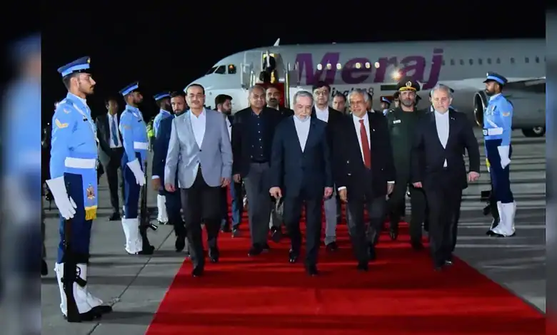 Iranian Foreign Minister Abbas Araghchi arrives at Nur Khan Airbase in Rawalpindi, Pakistan, walking on a red carpet beside a Meraj aircraft as honour guards stand at attention.