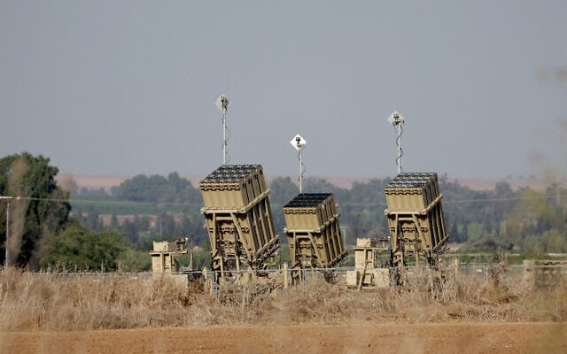 Iron Dome missile defence batteries positioned near the southern Israeli city of Sderot in an open field.