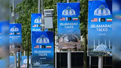 Banners display Pakistan and US flags with "Islamabad Talks" text, highlighting diplomatic discussions on.