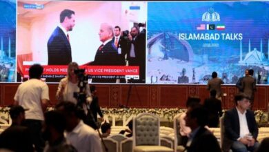 Media centre in Islamabad displaying Shehbaz Sharif and JD Vance during US–Iran talks.