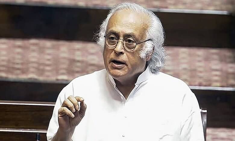 Indian politician speaking passionately, raising hand during a debate on Gaza conflict.