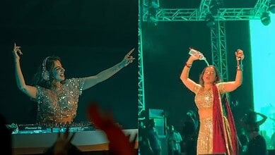 Jasmine Sandlas on stage, dancing and singing passionately during a bold concert moment. The vibrant ligh.