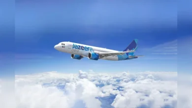 Jazeera Airways aircraft flying above clouds