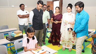 Children using new educational tools in a transformed school classroom.