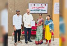 Manjula submits petition to Mandha Bheem Reddy during Pravasi Prajavani in Hyderabad.