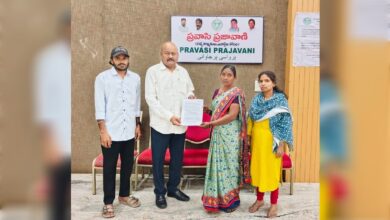 Manjula submits petition to Mandha Bheem Reddy during Pravasi Prajavani in Hyderabad.