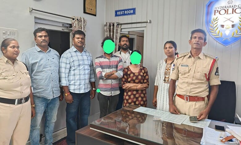 The image shows a woman and a man detained for gold theft, with police officers and family members in a Hyderabad police station setting.