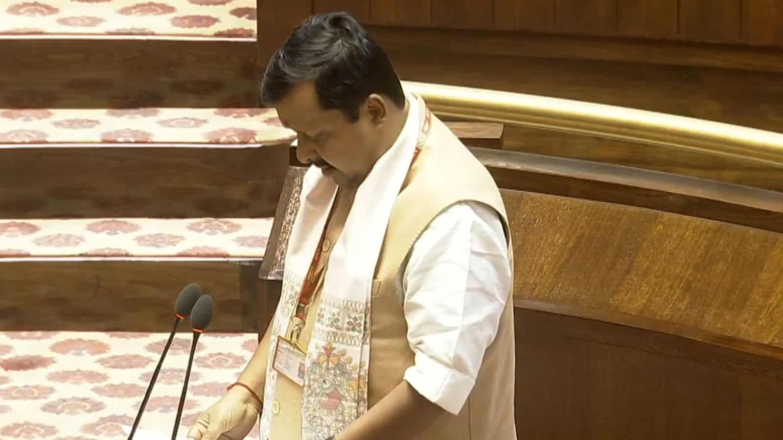 Nitin Nabin and Abhishek Manu Singhvi taking oath during Rajya Sabha session, highlighting political lead.
