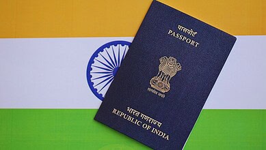 A photograph of an Indian passport on the Indian flag, highlighting passport issuance and appointment scheduling in Hyderabad.