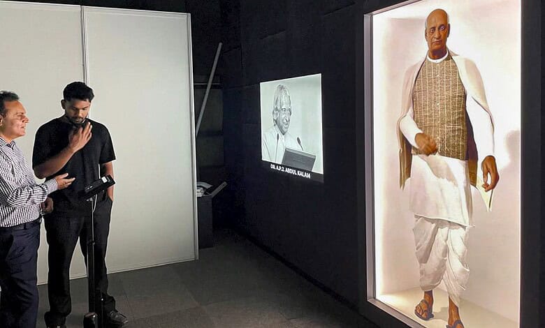 AI avatars of Gandhi and Vajpayee displayed at Delhi's PM Museum. Visitors observe the lifelike digital r.