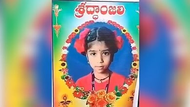 Young girl dressed in traditional attire with floral accessories, celebrating a cultural festival.